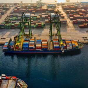 Aerial shot of colorful shipping containers at North Jakarta's bustling port, Indonesia.